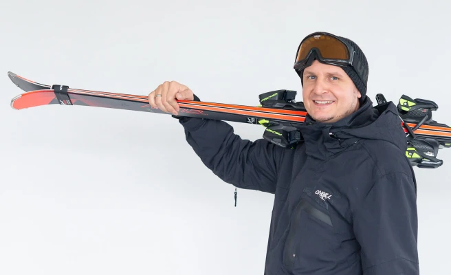 Employee Gerold Pree with alpine skis