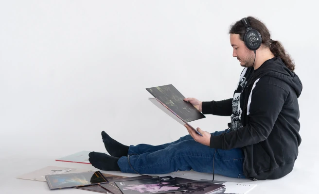 Employee Josef Steger listens to music records