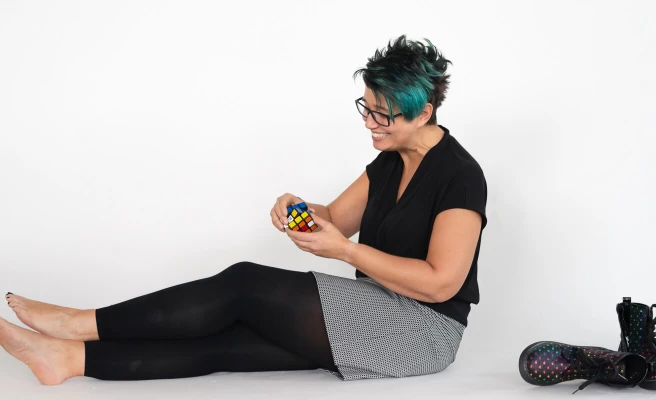 Employee Karin Scheiblhofer plays with a Rubik's cube