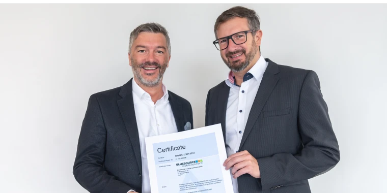 Wolfgang Stockner and Roland Sprengseis with the ISO certificate.